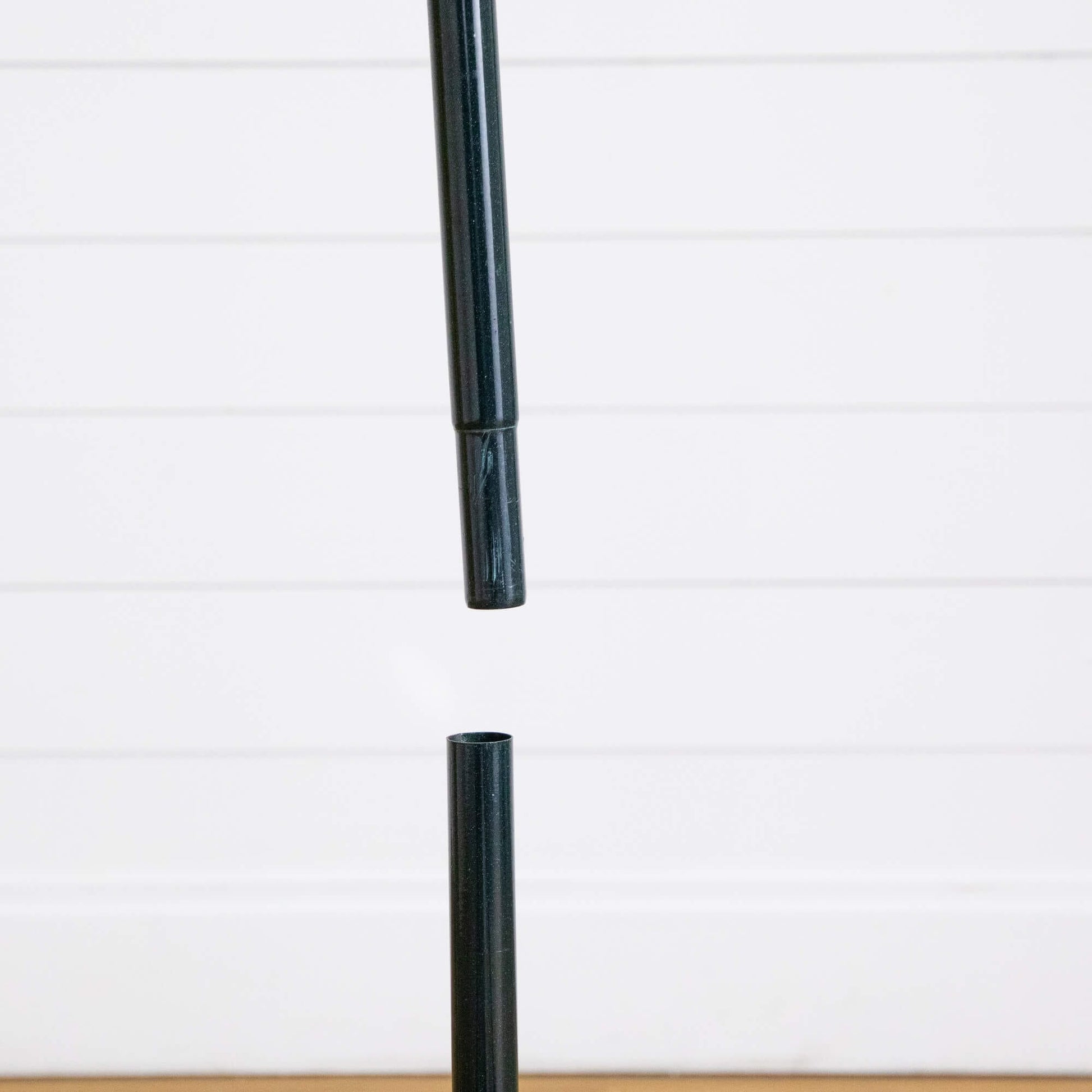 Black metal tree stand pole for a Nearly Natural 5 ft pre-lit Christmas tree on Tampa Home & Garden Store
