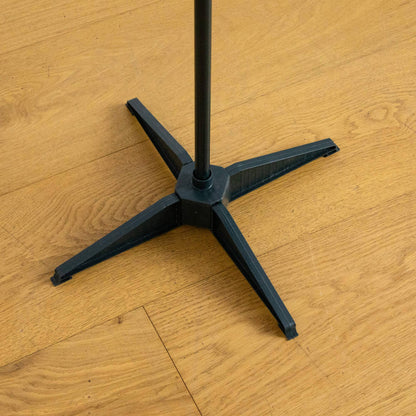 Nearly Natural Christmas tree stand base, black cross-shaped with vertical pole on wooden floor on Tampa Home & Garden Store