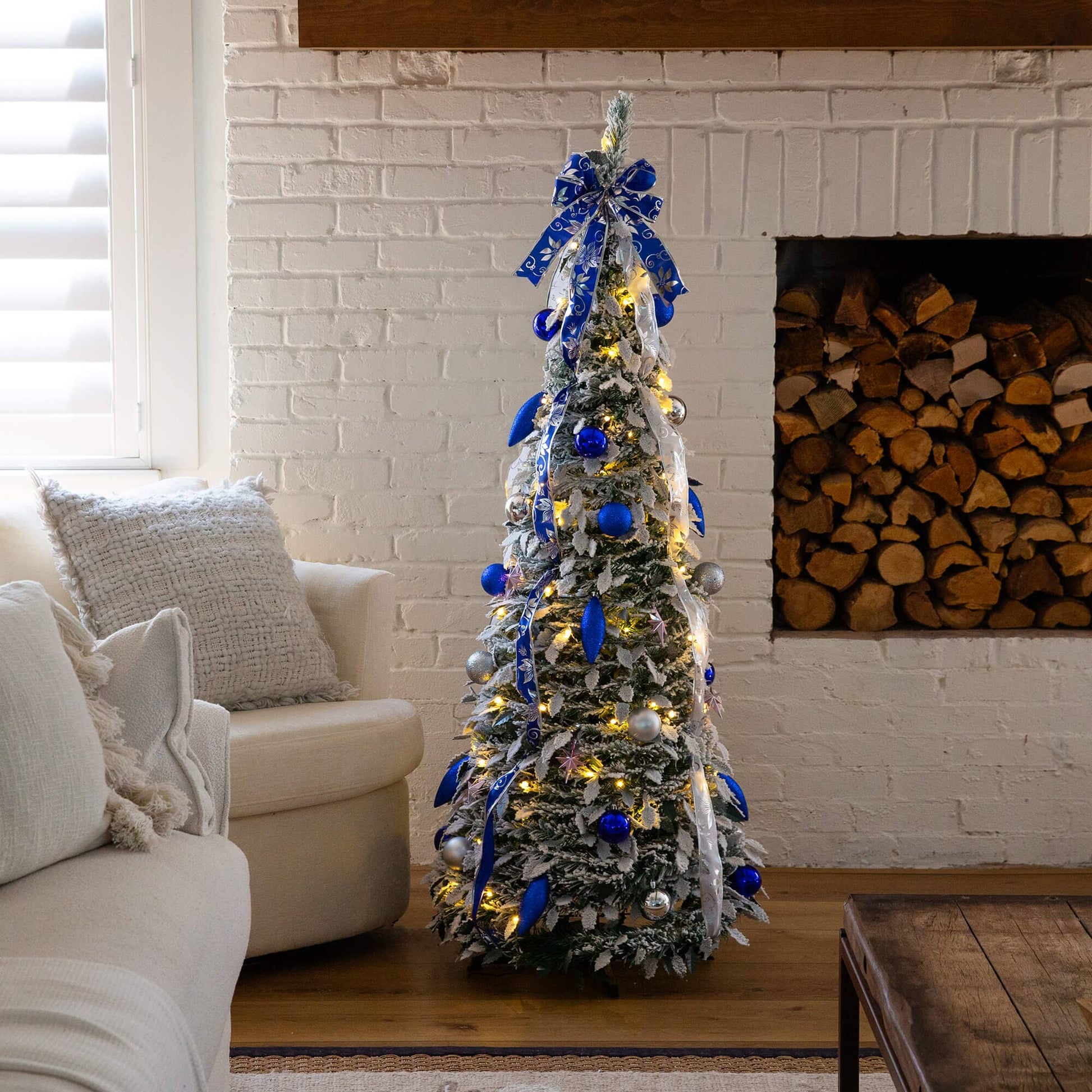 5 ft Nearly Natural pre-lit flocked Christmas tree with blue ribbons and silver ornaments lights on Tampa Home & Garden Store