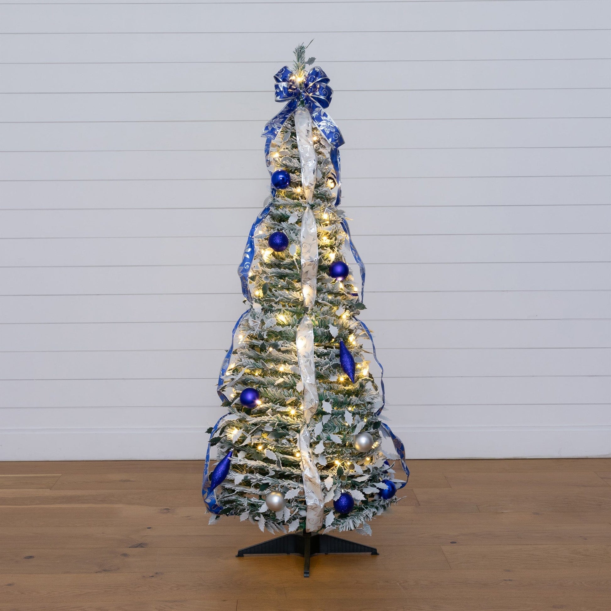 5 ft Nearly Natural pre-lit flocked Christmas tree with blue/silver ornaments and ribbons, 100 LEDs on Tampa Home & Garden Store