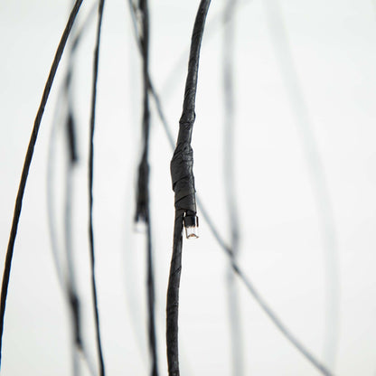 Willow tree LED string lights close-up on black wrapped wire with clear bulb on Tampa Home & Garden Store