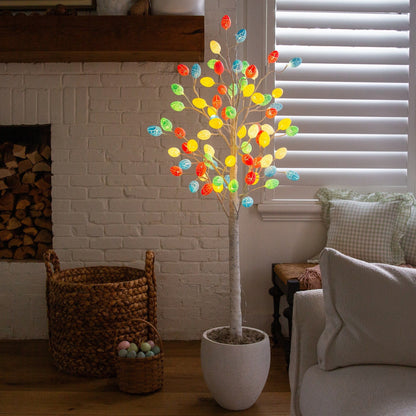 5' pre-lit Easter twig tree with 72 colorful egg-shaped LED ornaments in a white pot on Tampa Home & Garden Store