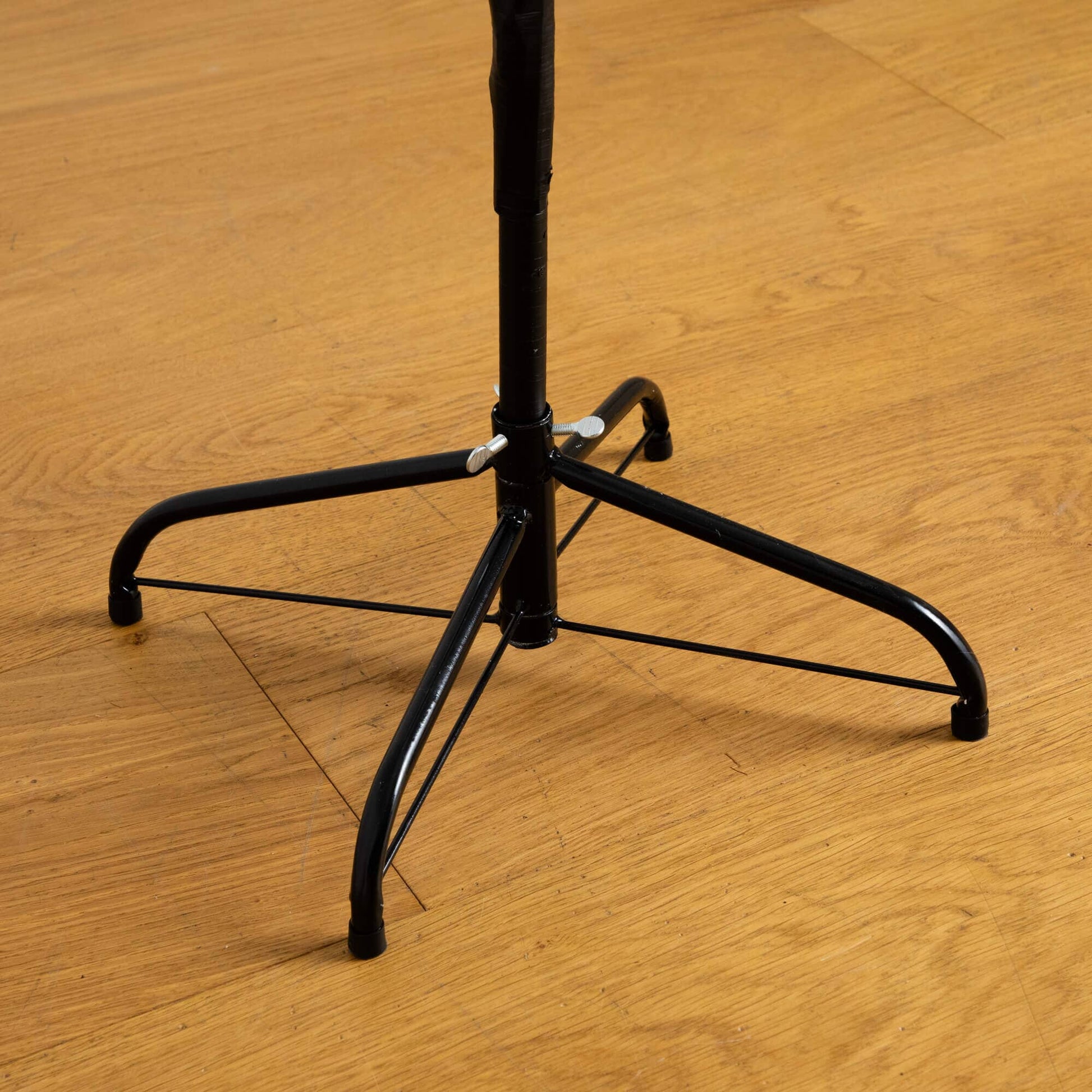 6ft pre-lit Halloween starburst tree base, black metal, Nearly Natural on wooden floor on Tampa Home & Garden Store