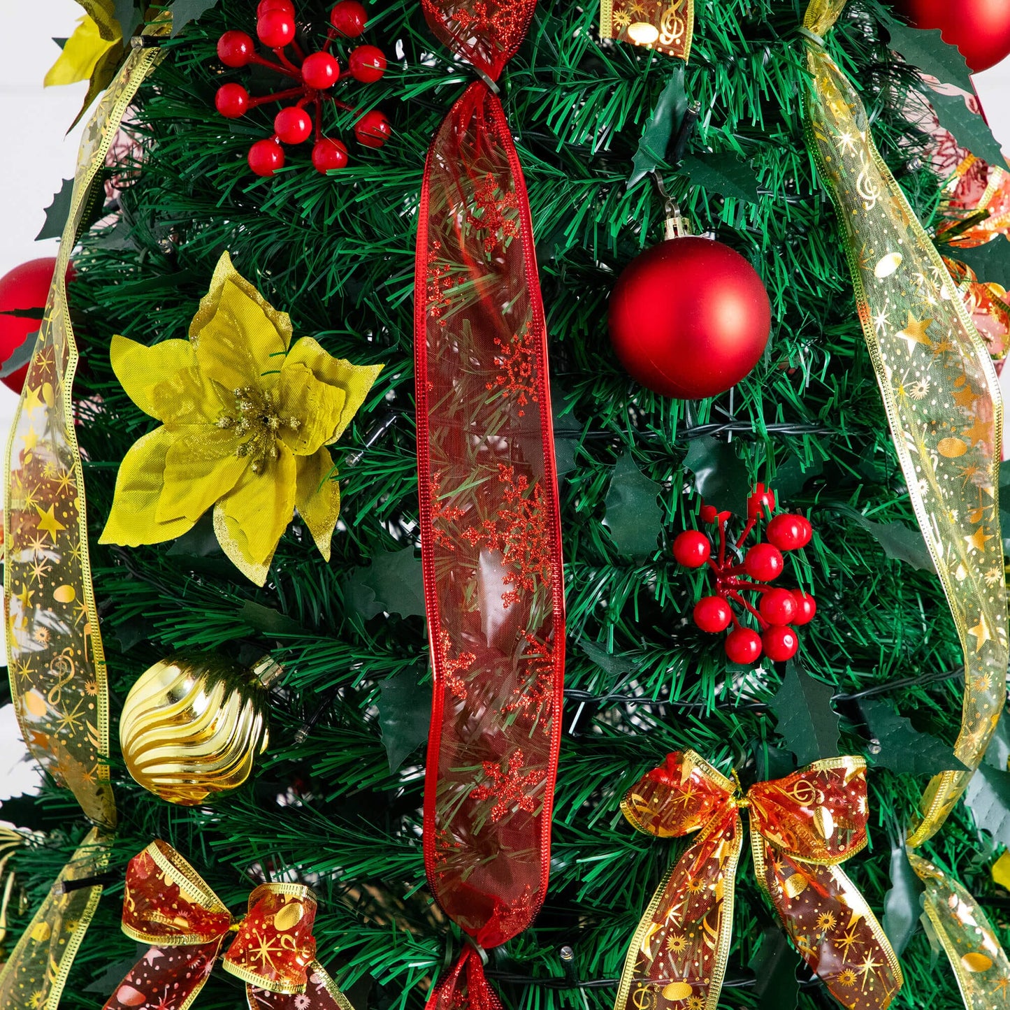 6' Pre-Lit Christmas Tree close-up with red and gold ribbons, ornaments and warm white LEDs on Tampa Home & Garden Store