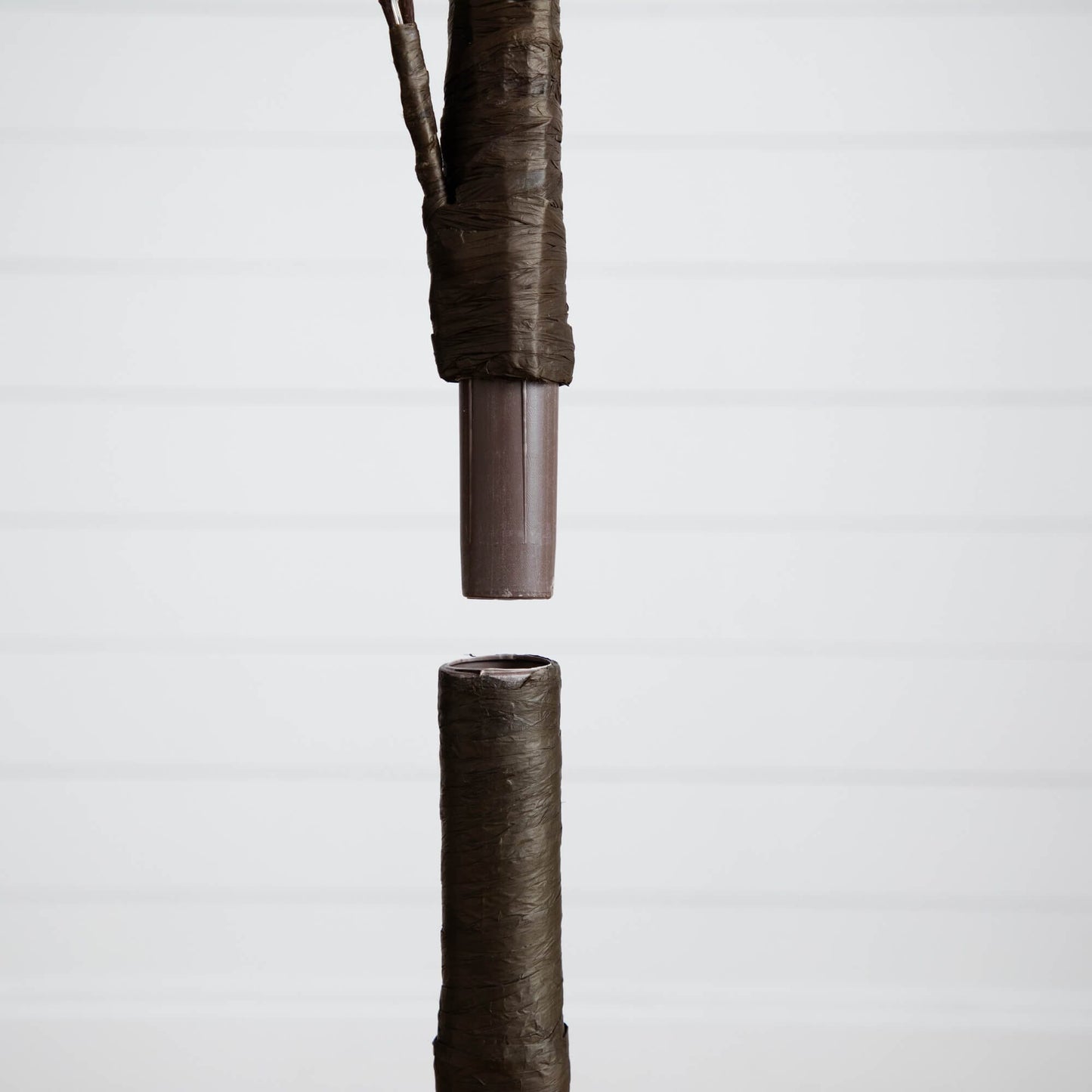 6 ft pre-lit autumn eucalyptus artificial tree trunk wrapped in brown protective material by Nearly Natural on Tampa Home & Garden Store