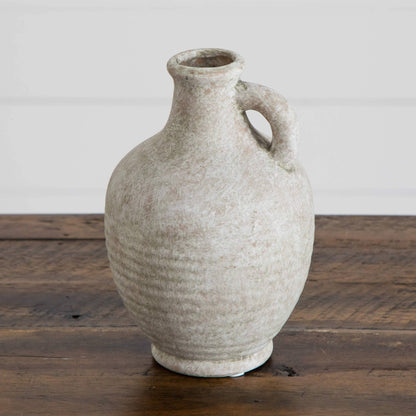 7-inch natural ceramic jug vase with weathered beige glaze and curved handle on a wooden surface on Tampa Home & Garden Store