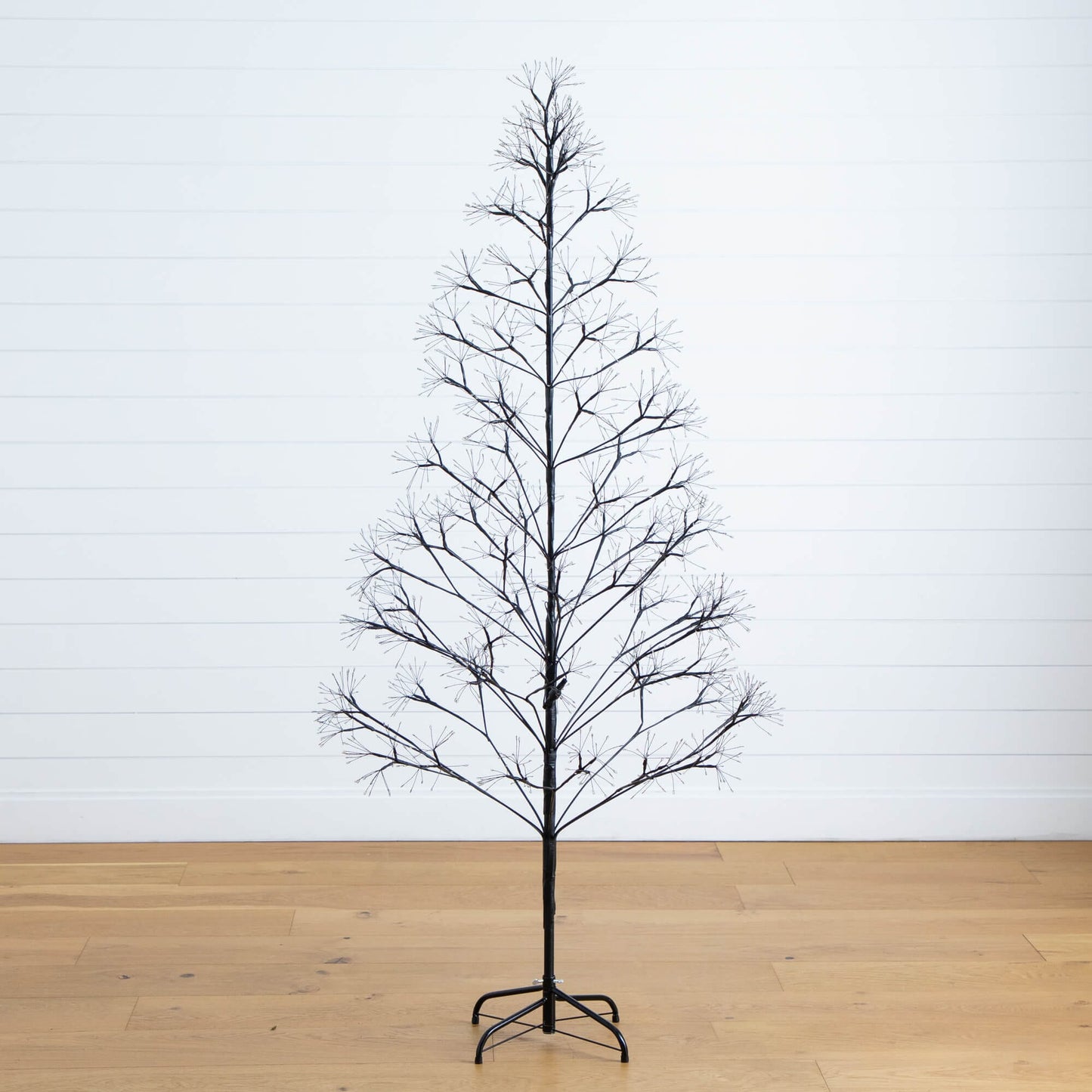 Halloween tree 6 ft black starburst with bare branches on metal stand on Tampa Home & Garden Store