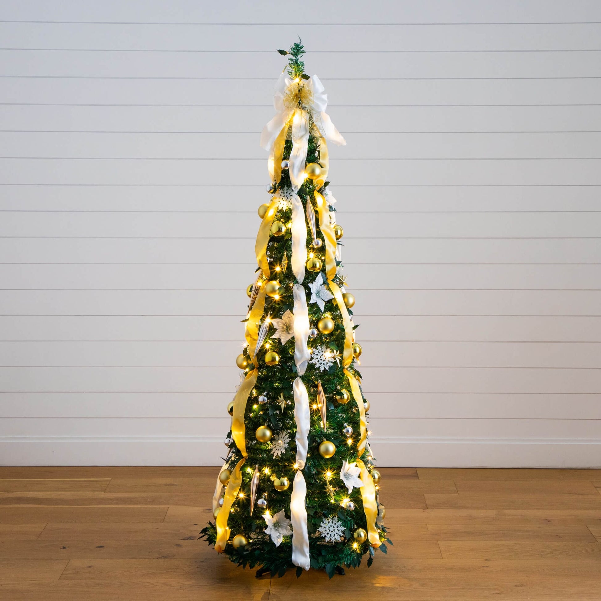 6 ft Nearly Natural lit artificial Christmas tree with gold ornaments, ribbons and warm LEDs on Tampa Home & Garden Store