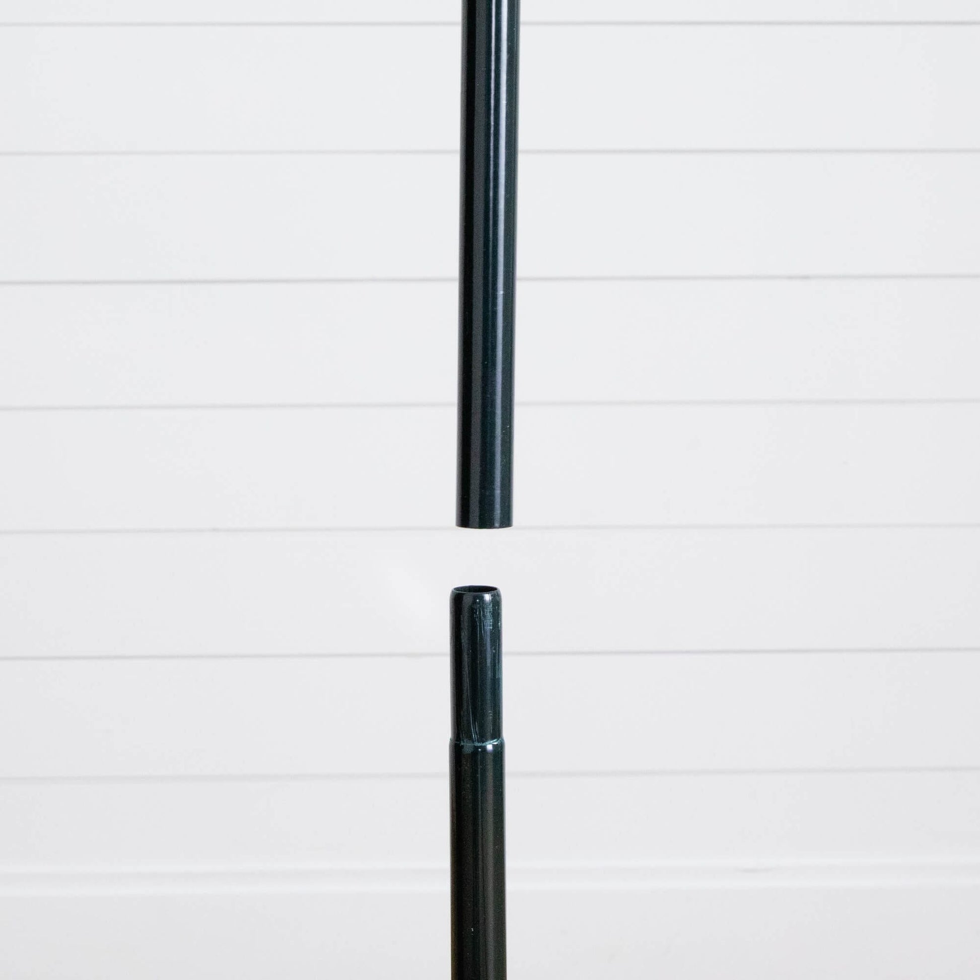 Black metal tree pole segment from Nearly Natural pop-up Christmas tree against white backdrop on Tampa Home & Garden Store