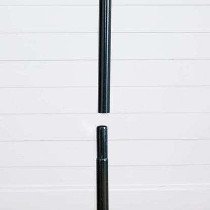 Black metal tree pole segment from Nearly Natural pop-up Christmas tree against white backdrop on Tampa Home & Garden Store