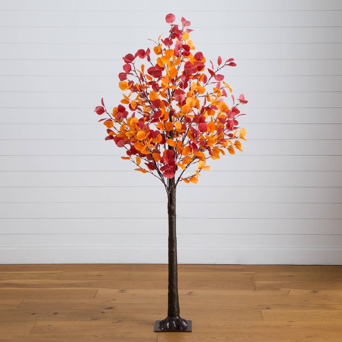 6' pre-lit artificial eucalyptus tree with orange-red autumn leaves, dark trunk and square base on Tampa Home & Garden Store