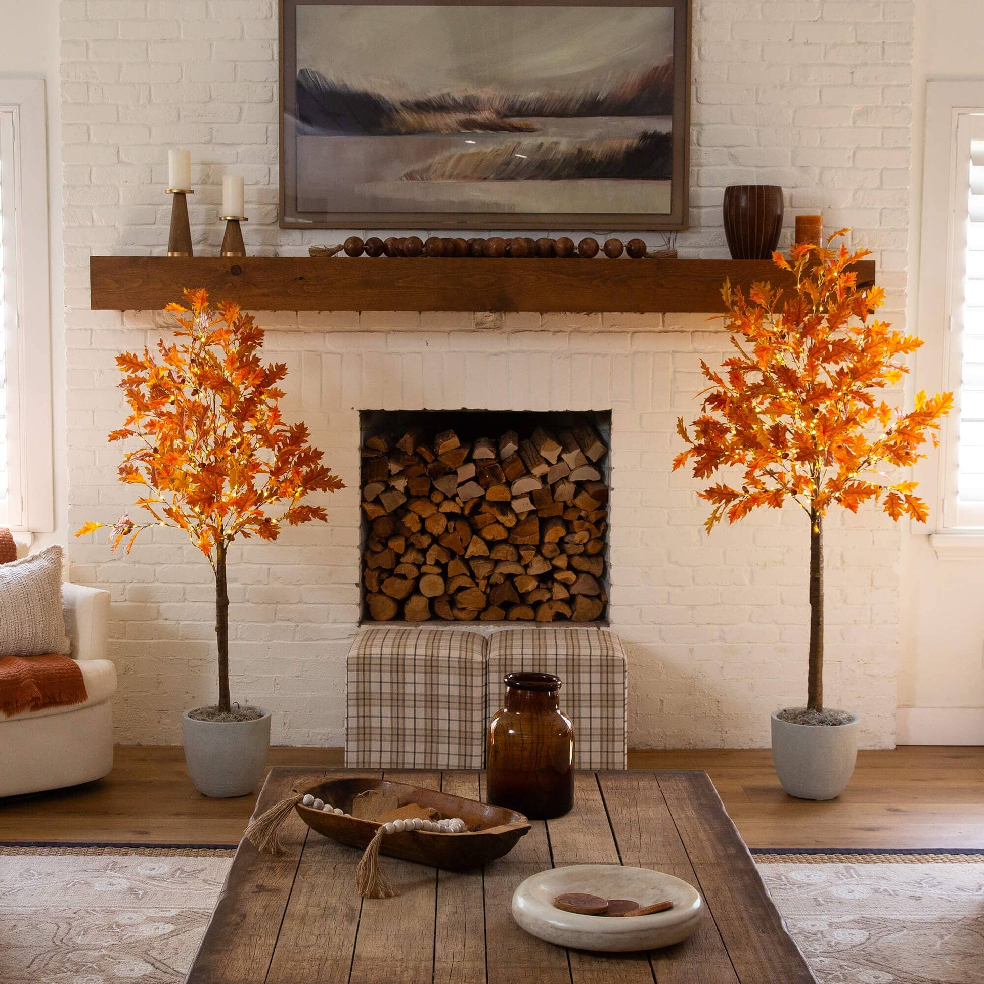 Two Nearly Natural 6' burnt orange autumn maple trees with 300 warm white LEDs in a living room on Tampa Home & Garden Store