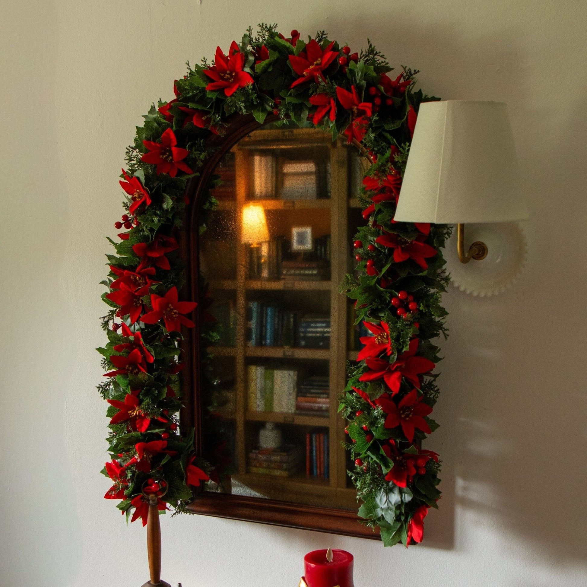 6’ poinsettia & berry garland by Nearly Natural, UV resistant with red blooms around mirror on Tampa Home & Garden Store