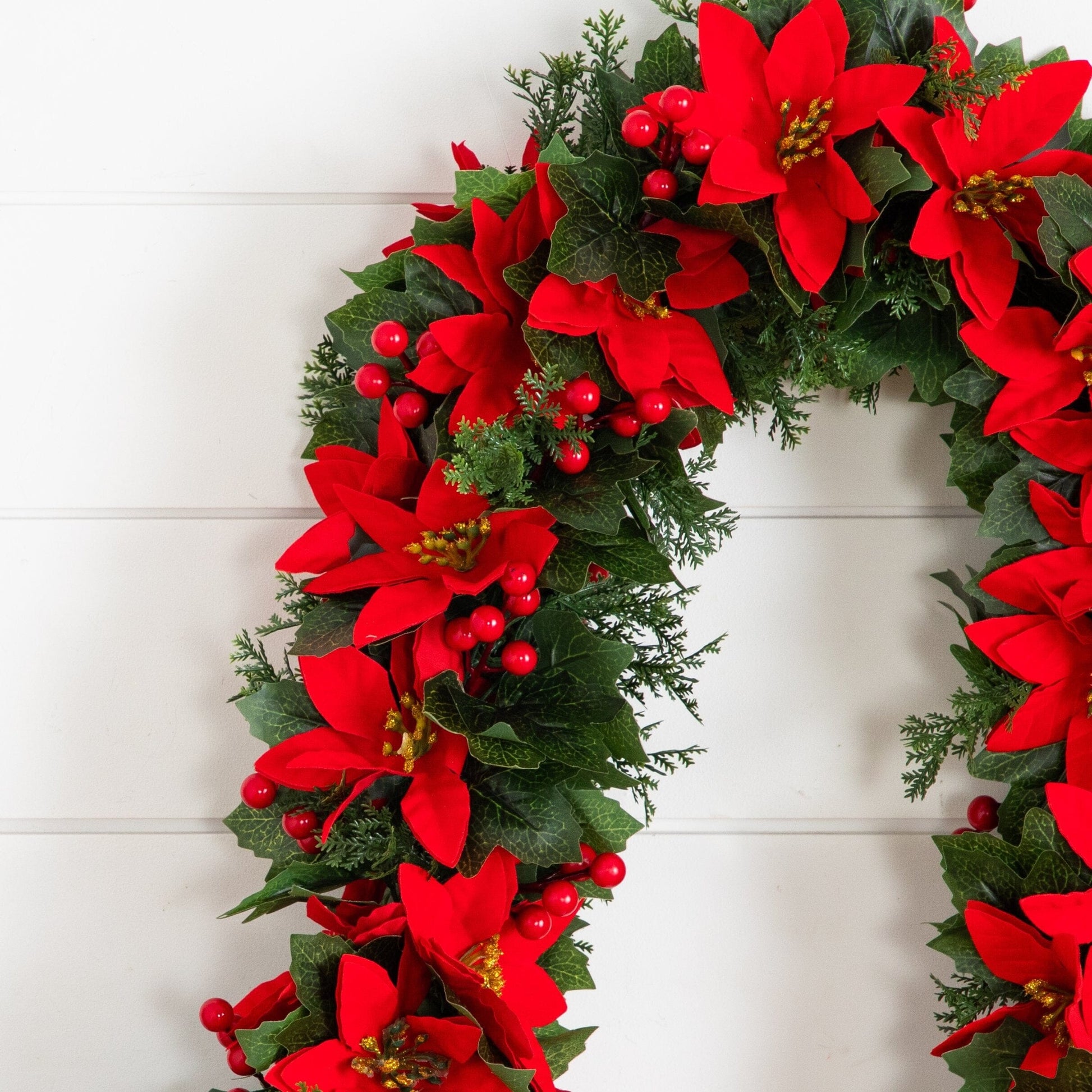 6 ft UV resistant poinsettia and berries garland with red flowers and green leaves on Tampa Home & Garden Store