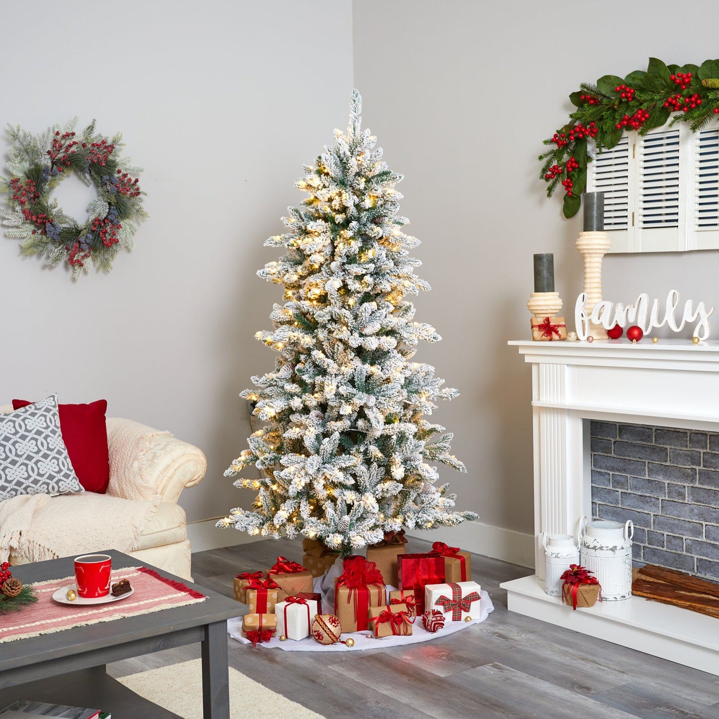 6.5' flocked Livingston Fir artificial Christmas tree with pine cones and 300 warm LED lights on Tampa Home & Garden Store
