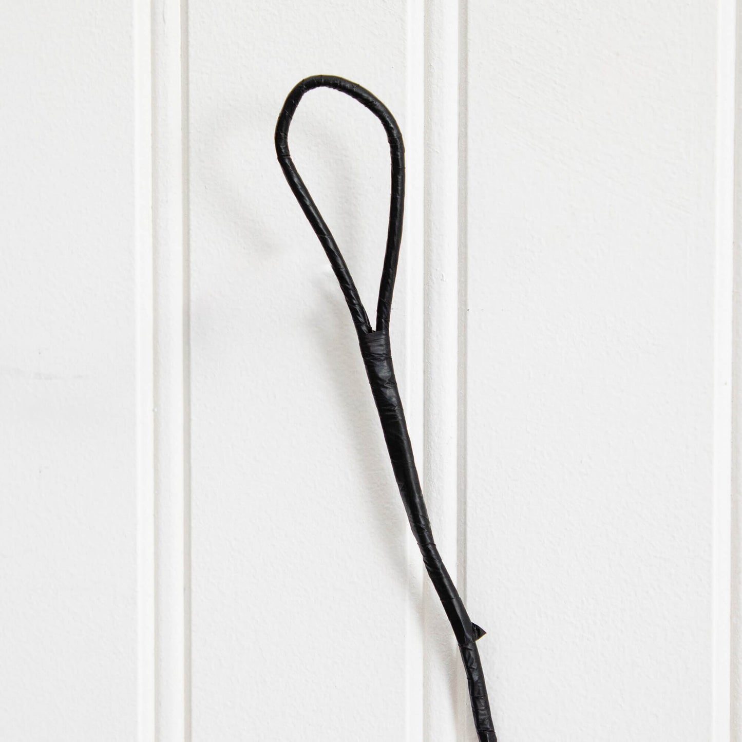 Garland 6.5' Pre-Lit Halloween Black Twig with 48 Purple LEDs, close-up of black cord loop on Tampa Home & Garden Store