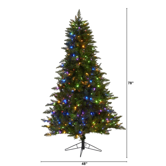Nearly Natural 6.5 ft Vermont Spruce artificial Christmas tree with multicolor lights on a stand on Tampa Home & Garden Store