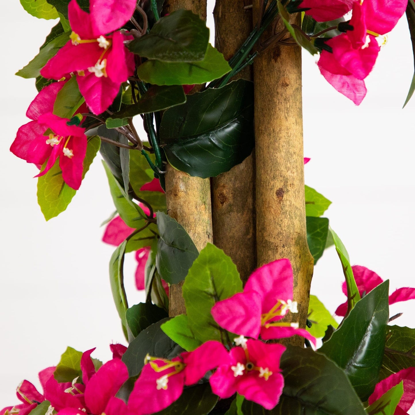 Artificial spiral bougainvillea tree with pink blooms and leaves wrapped around a brown trunk on Tampa Home & Garden Store