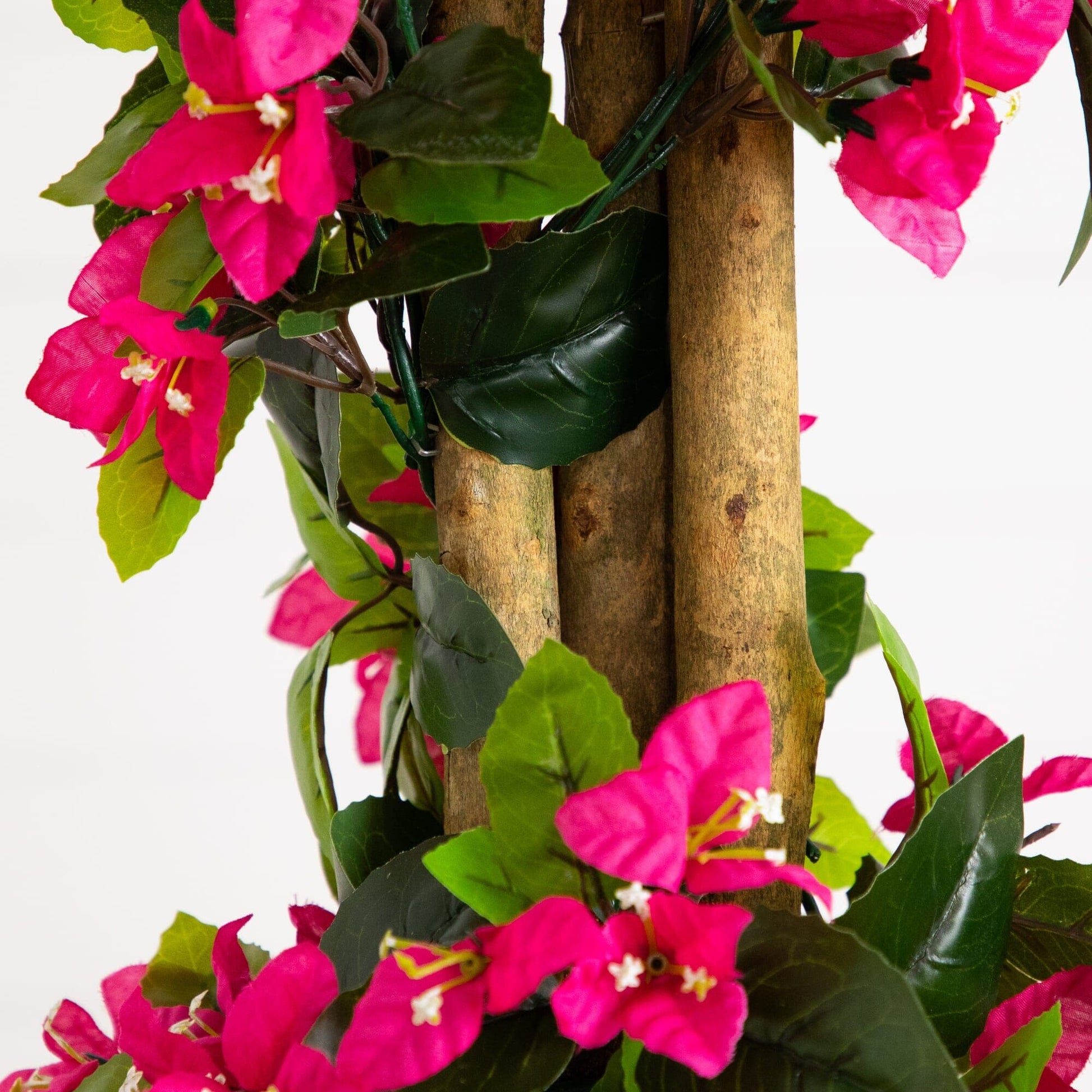 Artificial spiral bougainvillea tree with pink blooms and leaves wrapped around a brown trunk on Tampa Home & Garden Store