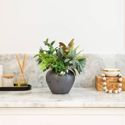 Nearly Natural 7 in Black Round Urn Vase planter with lush eucalyptus and assorted greens on Tampa Home & Garden Store