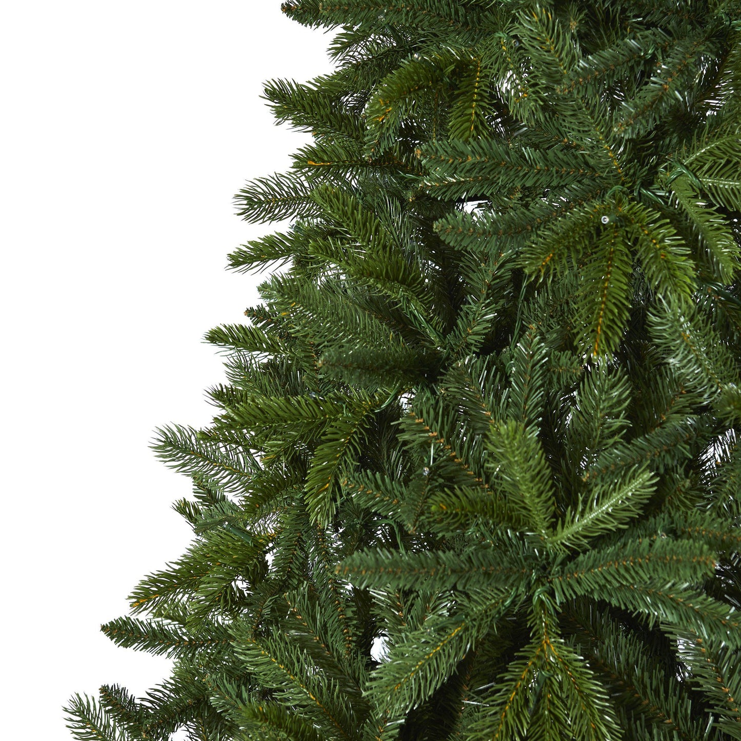 Artificial Christmas tree branches close-up with dense Sierra Spruce green needles on Tampa Home & Garden Store
