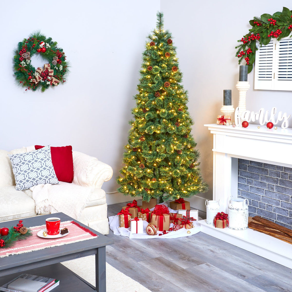 Nearly Natural 7’ White Mountain Pine artificial Christmas tree with 400 clear LED lights and pine cones in a festive living room on Tampa Home & Garden Store