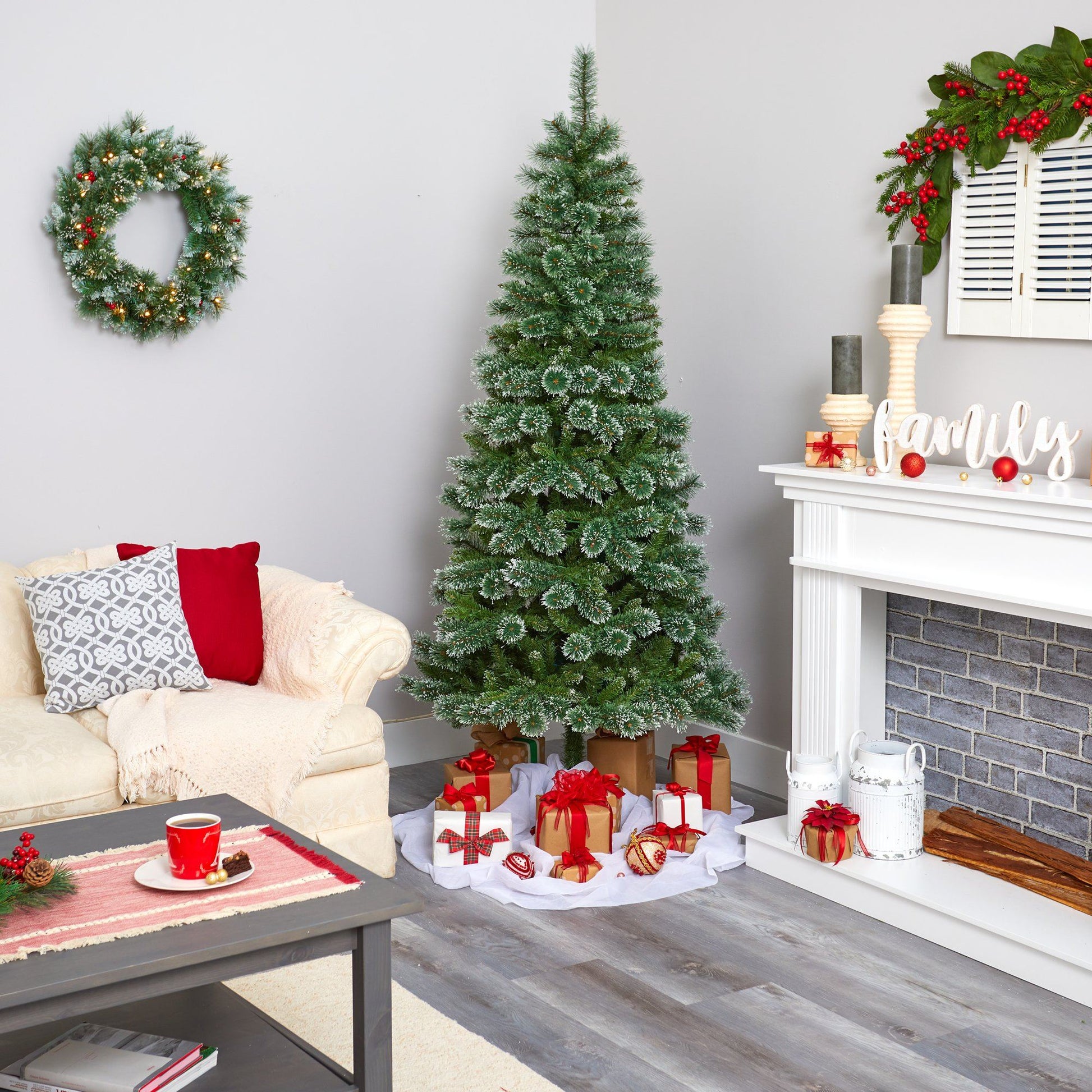 7' Wisconsin Slim Snow Tip Pine artificial Christmas tree with 400 LED lights in living room on Tampa Home & Garden Store
