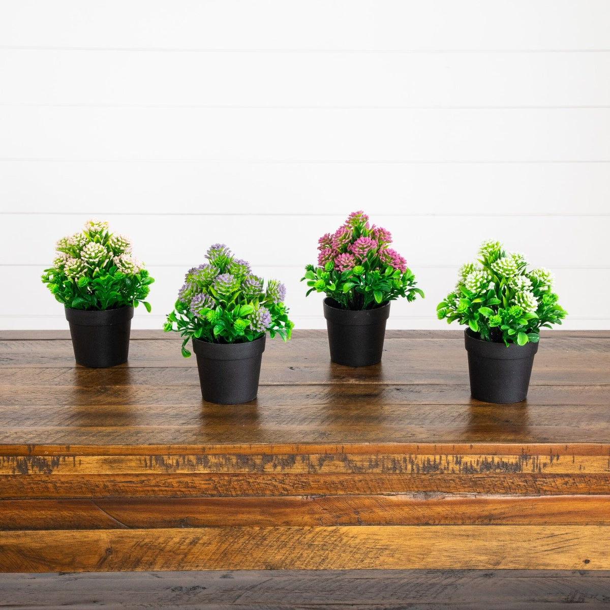 Set of 4 7.5-inch artificial flowering plants in black pots with varied blooms by Nearly Natural on Tampa Home & Garden Store