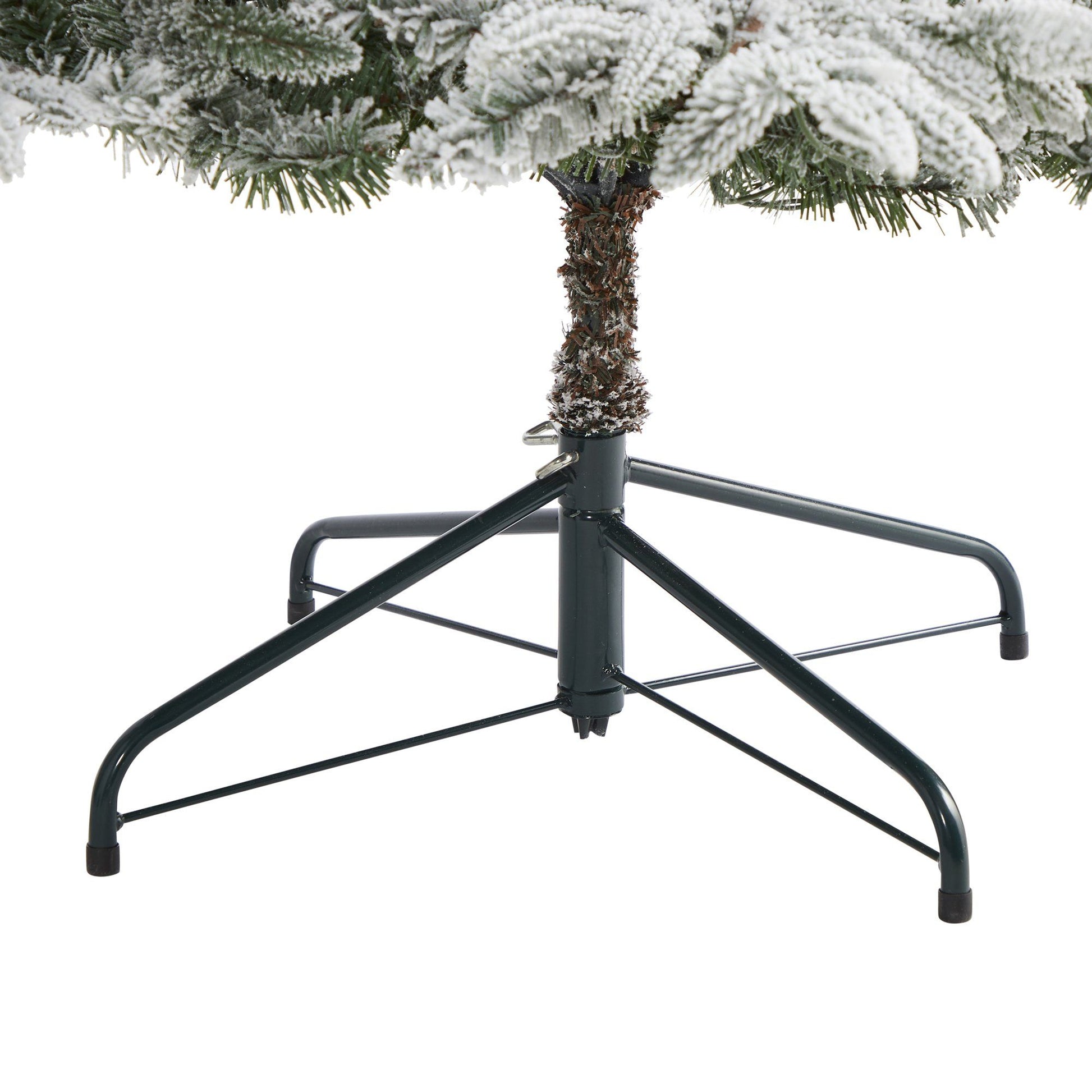 7.5 ft flocked Manchester Spruce Christmas Tree with 450 lights and 949 bendable branches on Tampa Home & Garden Store