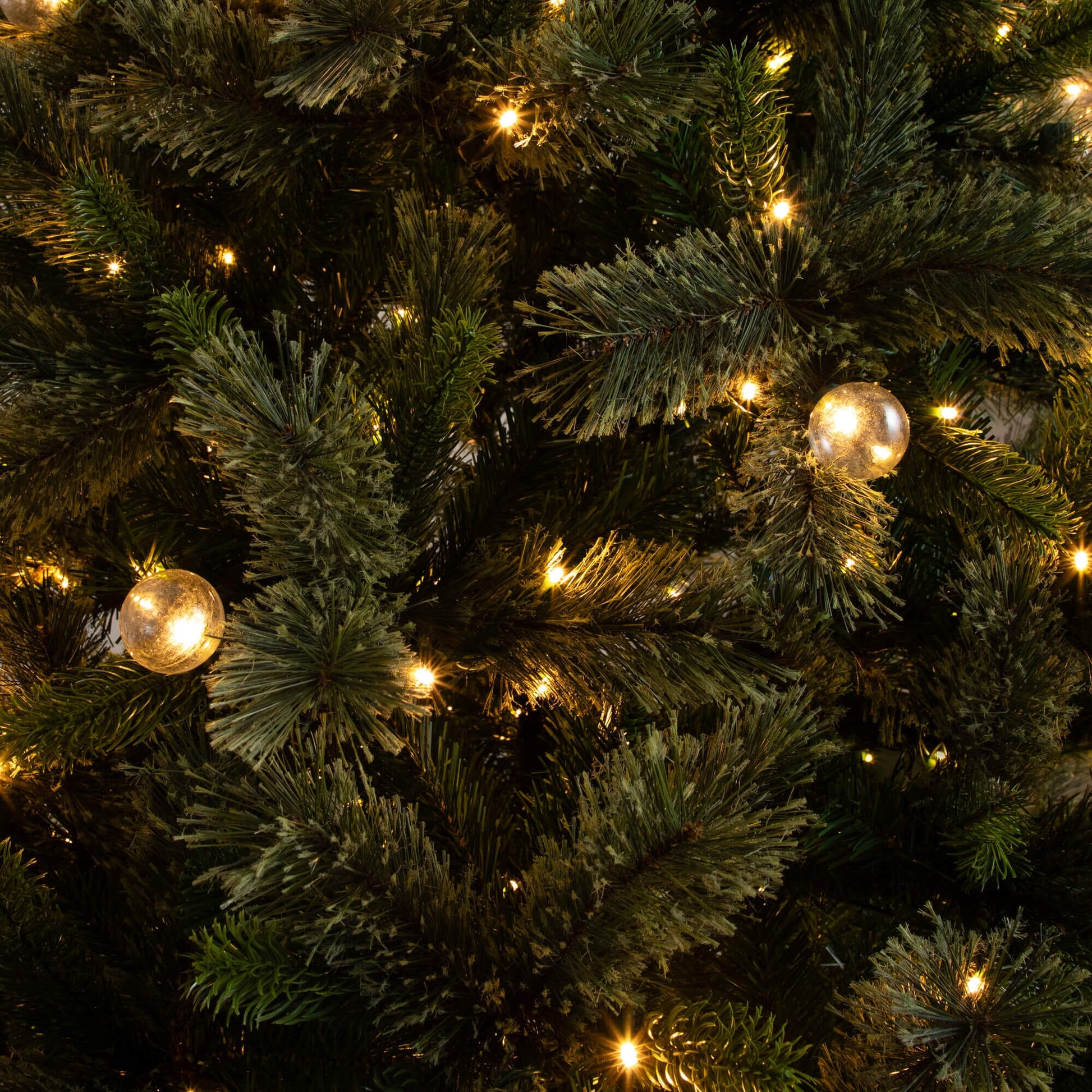 7.5' Nearly Natural artificial Christmas tree with 450 warm white globe bulbs and LED lights on Tampa Home & Garden Store