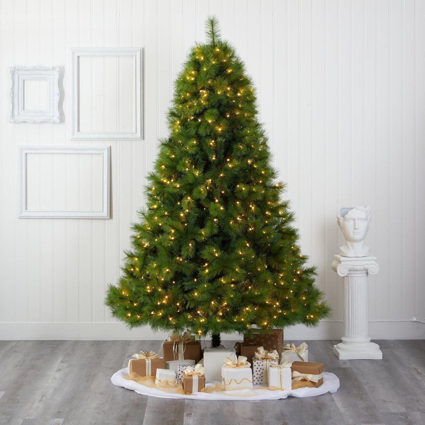 7.5ft green Scotch Pine artificial Christmas tree with 550 LED lights around wrapped gifts on Tampa Home & Garden Store