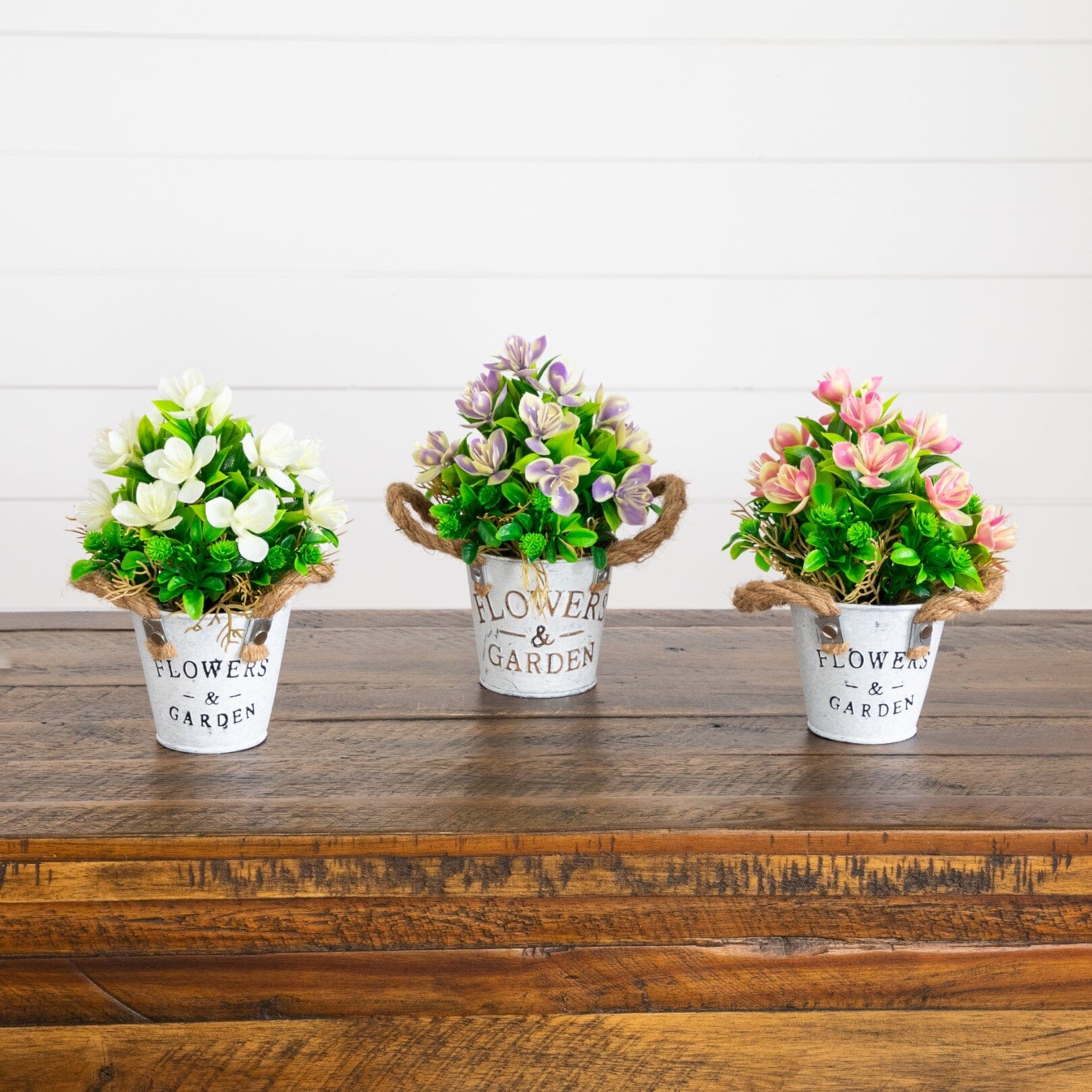 8-inch artificial flowering plant trio in rustic metal planters with jute rope handles on Tampa Home & Garden Store