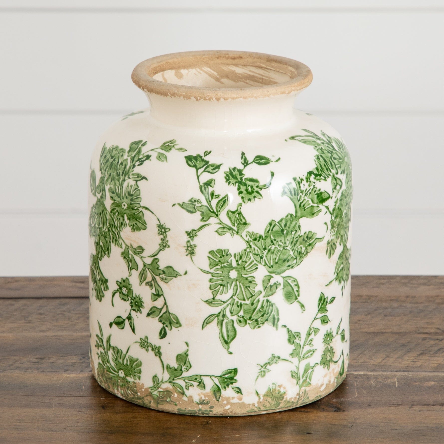 8-inch ceramic vase with green botanical scroll pattern on white ceramic body and a distressed tan rim on Tampa Home & Garden Store