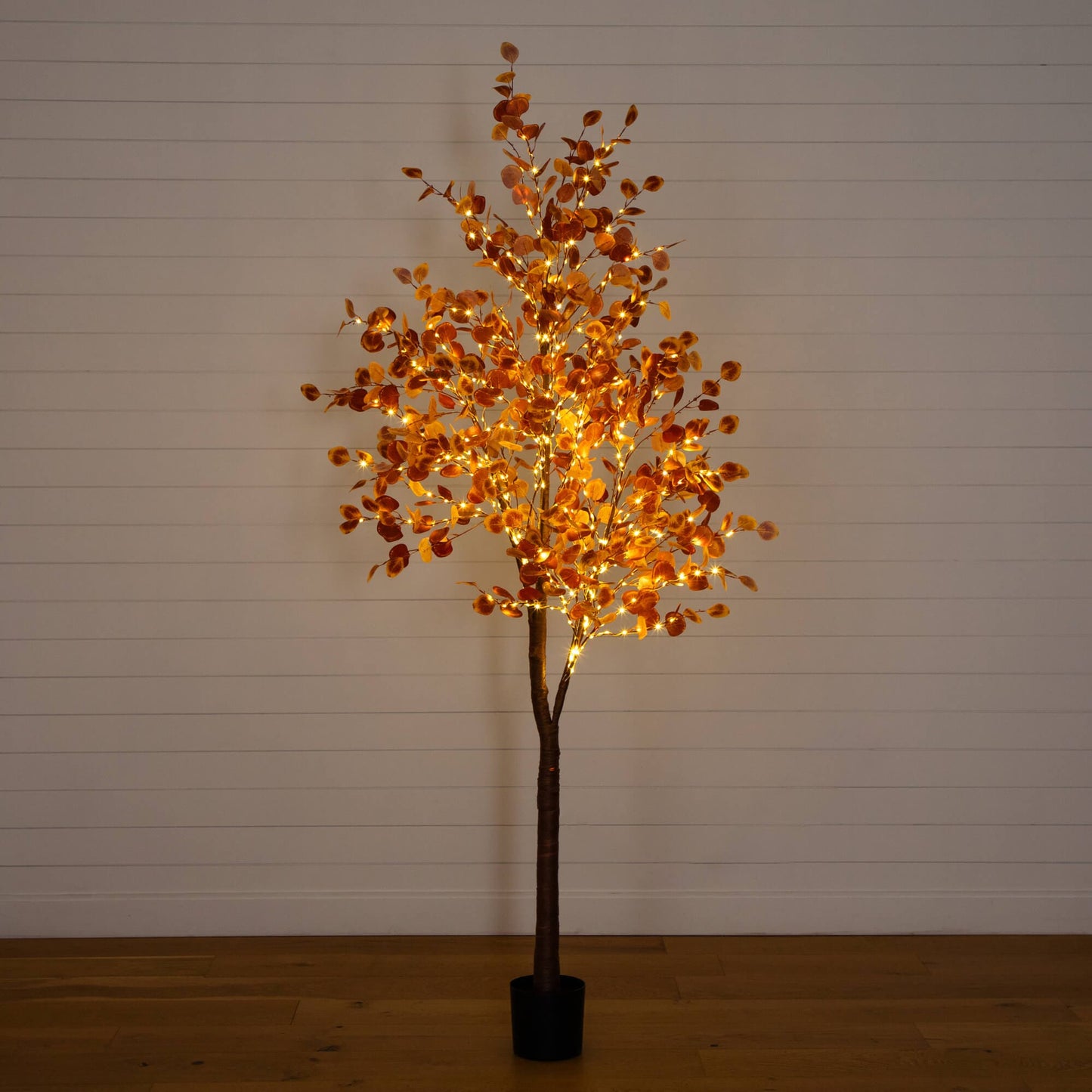8' Pre-Lit Autumn Eucalyptus Tree with 540 warm white LEDs, orange leaves in a black pot on Tampa Home & Garden Store