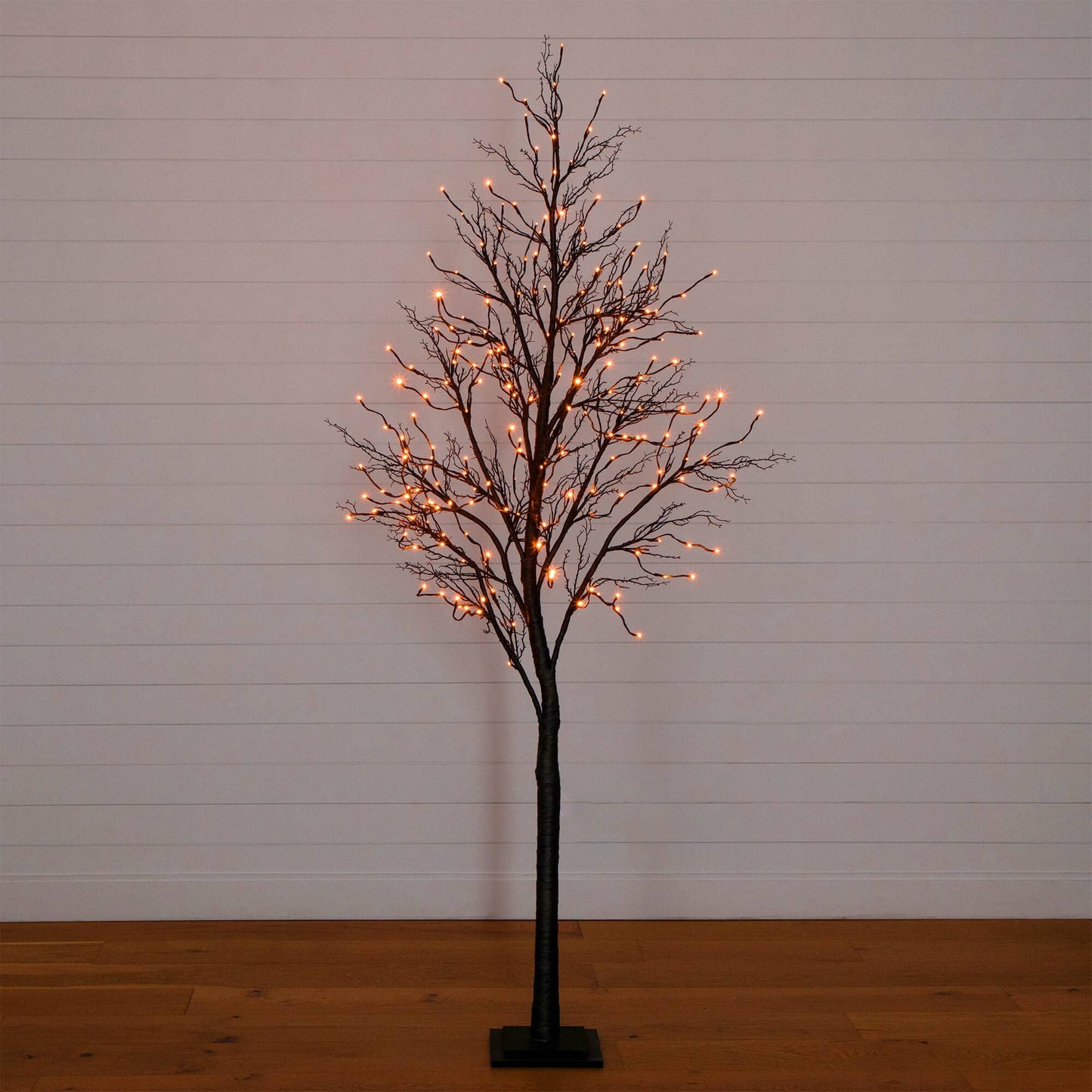 8' Black Twig Artificial Tree with orange LED lights on Tampa Home & Garden Store