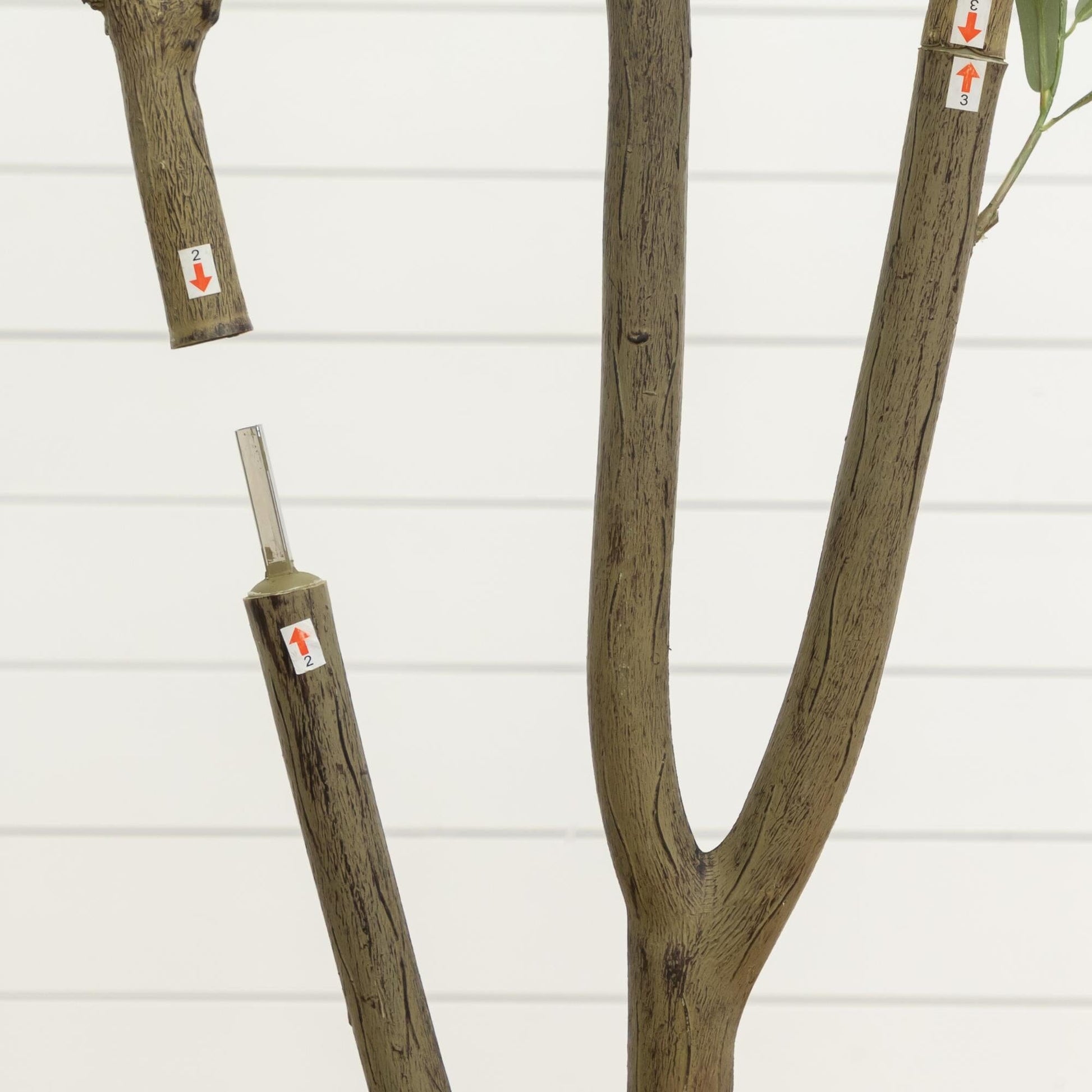 7' artificial olive tree in white planter with brown textured trunks and labeled stems on Tampa Home & Garden Store