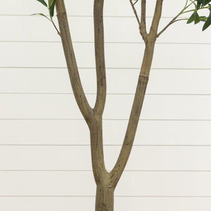 Artificial olive tree with three brown trunks and green leaves against a light background on Tampa Home & Garden Store