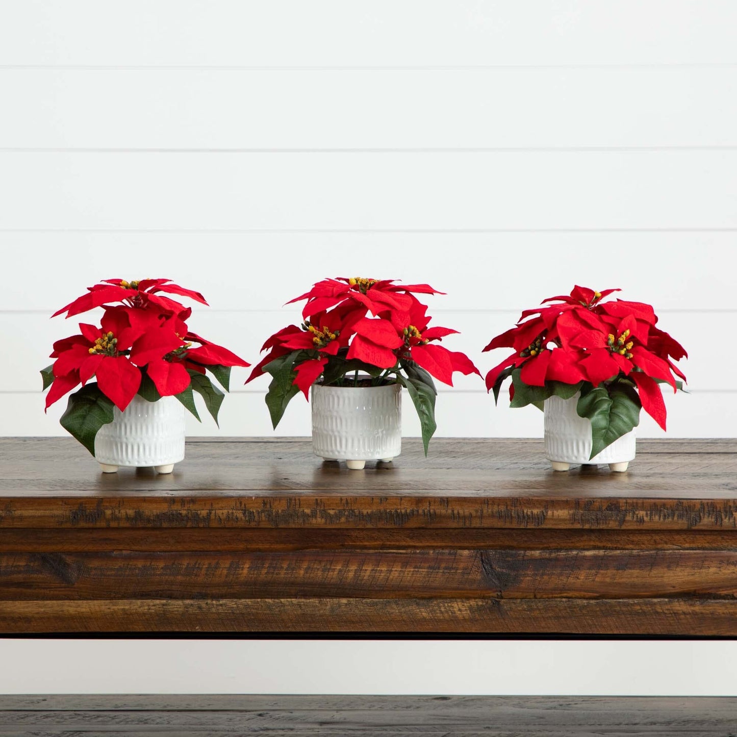 9in artificial poinsettia arrangements set of 3 in white ceramic pots with red blooms on Tampa Home & Garden Store