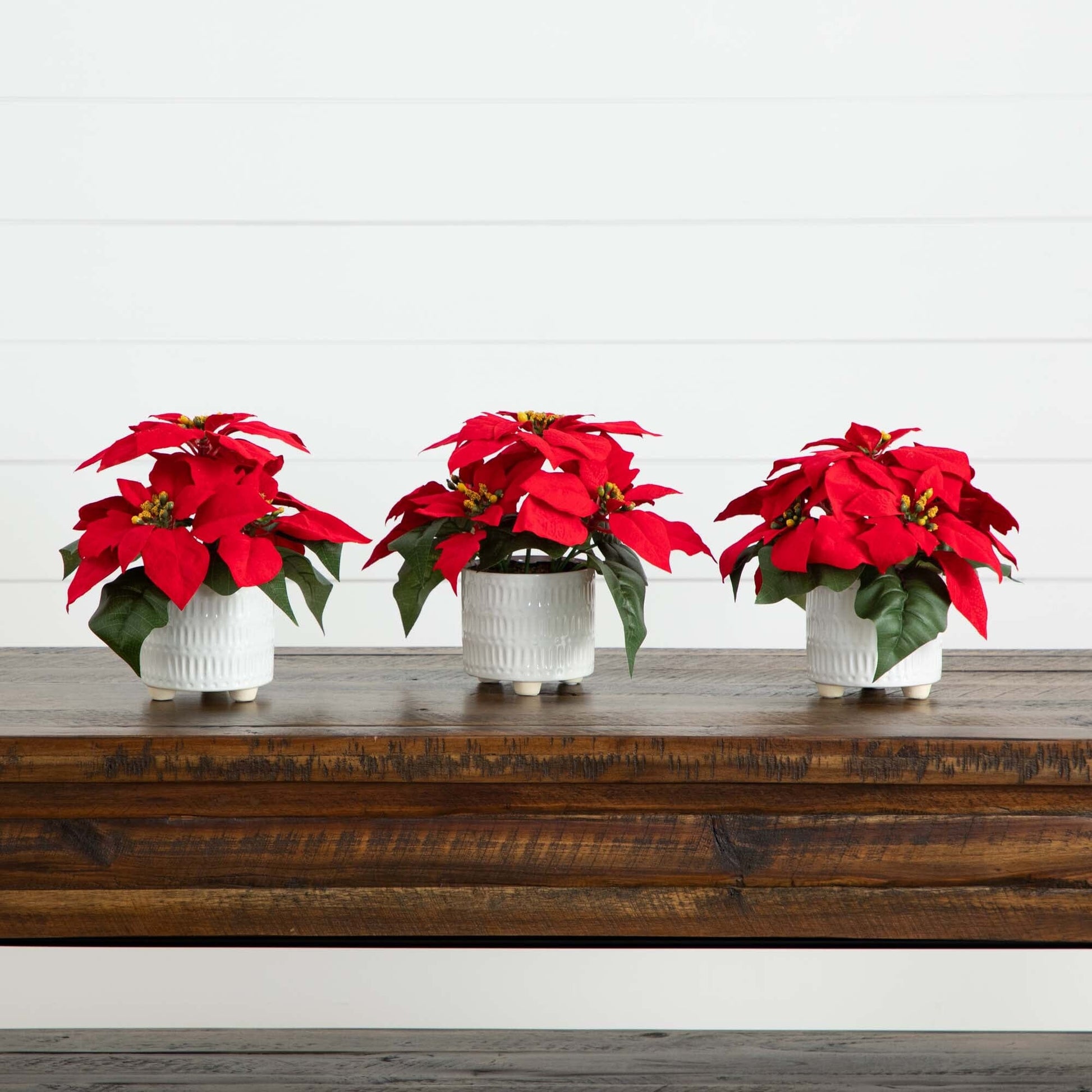 9in artificial poinsettia arrangements set of 3 in white ceramic pots with red blooms on Tampa Home & Garden Store