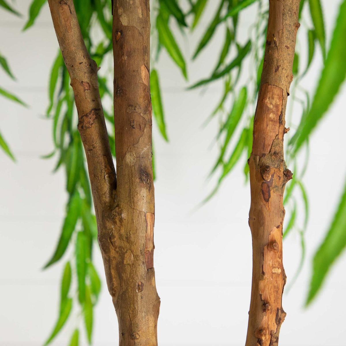 9-foot Willow Artificial Tree Real Touch trunk close-up with bark and green leaves Nearly Natural on Tampa Home & Garden Store