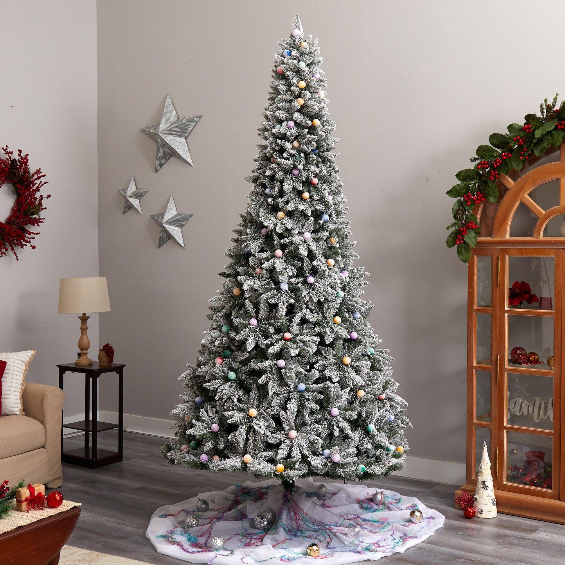 9.5 ft flocked British Columbia Mountain Fir artificial Christmas tree with snow-dusted branches on Tampa Home & Garden Store