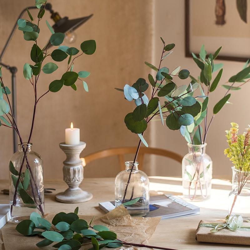 RusticReach artificial eucalyptus leaves in various shapes in glass bottles on Tampa Home & Garden Store