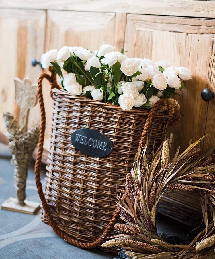 Artificial Eco PE camellia bloom stems set in white in a woven wicker basket RusticReach on Tampa Home & Garden Store