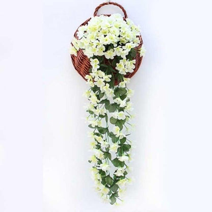 Artificial wisteria hanging basket with cream flowers and green leaves in a brown wicker basket on Tampa Home & Garden Store