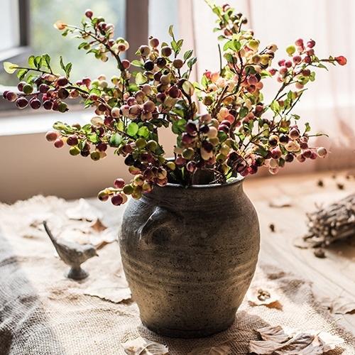 Artificial berry stem with yellow and red berries in a rustic ceramic vase 17 inches tall on Tampa Home & Garden Store