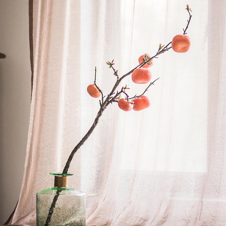 Artificial persimmon fruit stem 43in tall with orange fruits on a branch in a green glass vase on Tampa Home & Garden Store