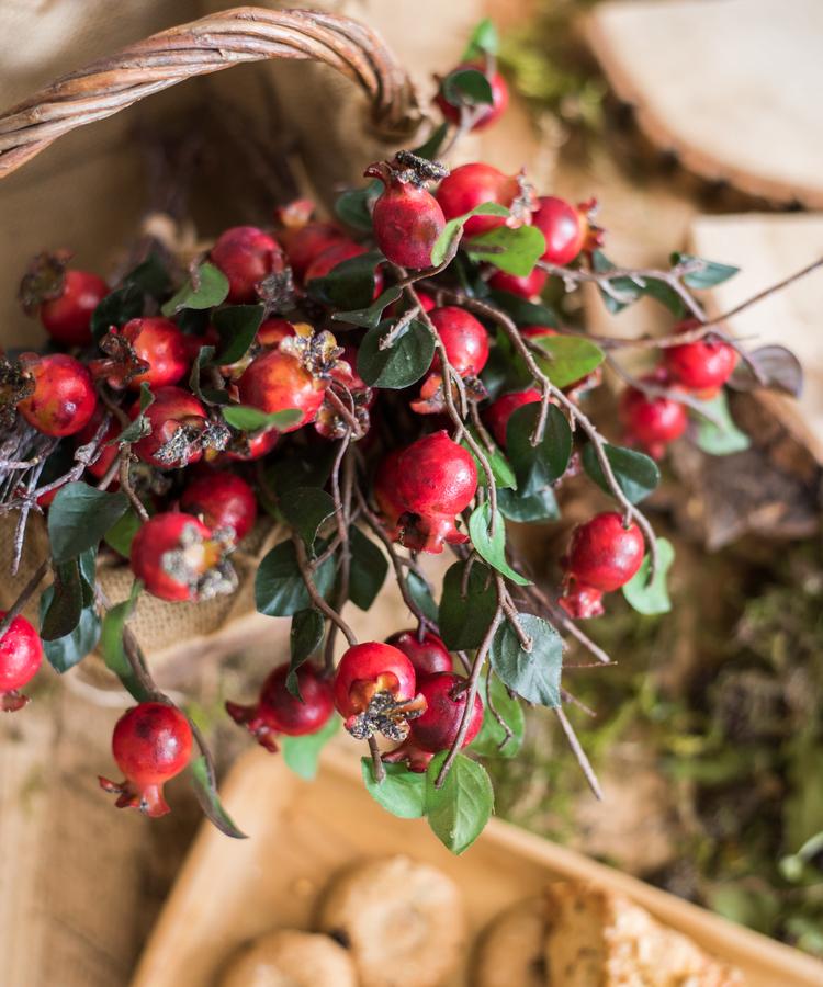Artificial pomegranate fruit bouquet 12in tall with red faux berries and green leaves on Tampa Home & Garden Store