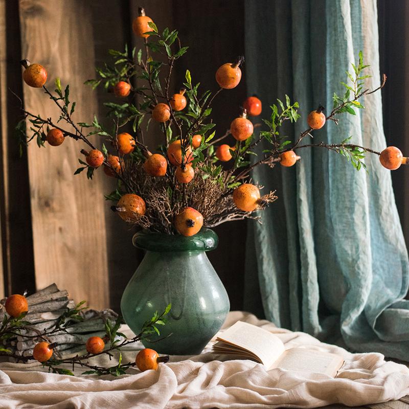 RusticReach artificial fruit stem with yellow-orange pomegranates in a green vase, 36-inch tall on Tampa Home & Garden Store