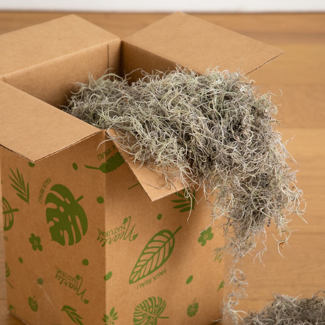 Natural Spanish Moss plant filler 5 lbs by Nearly Natural spilling from a decorative box on Tampa Home & Garden Store