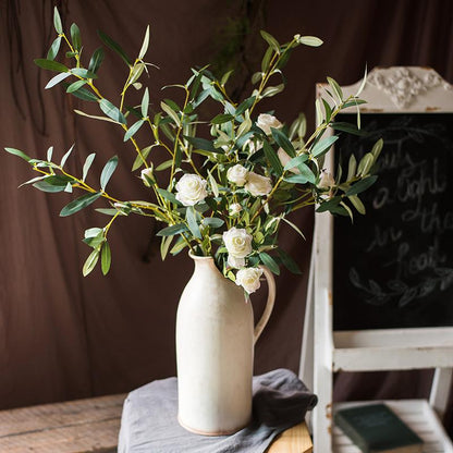 Artificial Faux Olive Leaf Stem by RusticReach in a ceramic pitcher with white faux roses on Tampa Home & Garden Store